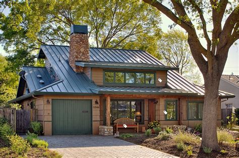 brown house kelly green metal roof|house with green roof.